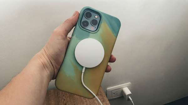 Editorial illustration for Why Magnetic Alignment Fixed Wireless Charging: Qi vs. MagSafe vs. Qi2